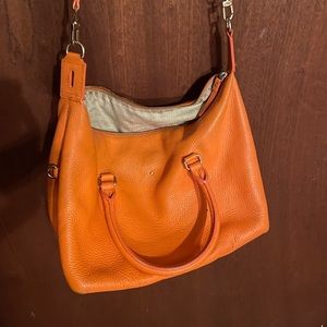 Orange Kate spade crossbody purse